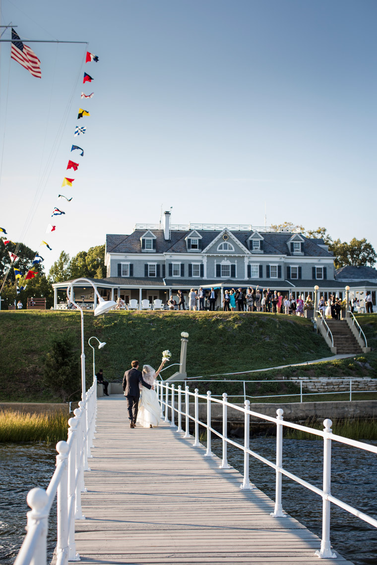 bride and groom arriving by boat to Seawanhaka Yacht Club Oyster Bay NY