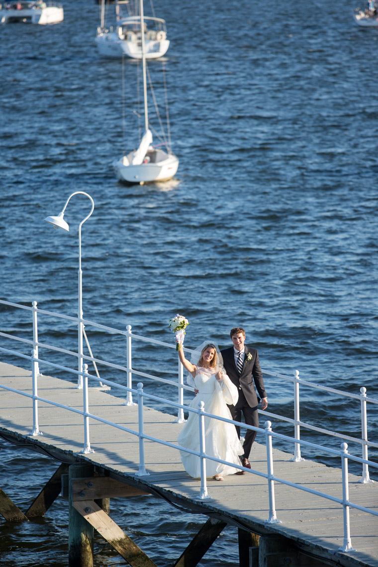bride and groom arriving by  boat to Seawanhaka Yacht Club Oyster Bay NY