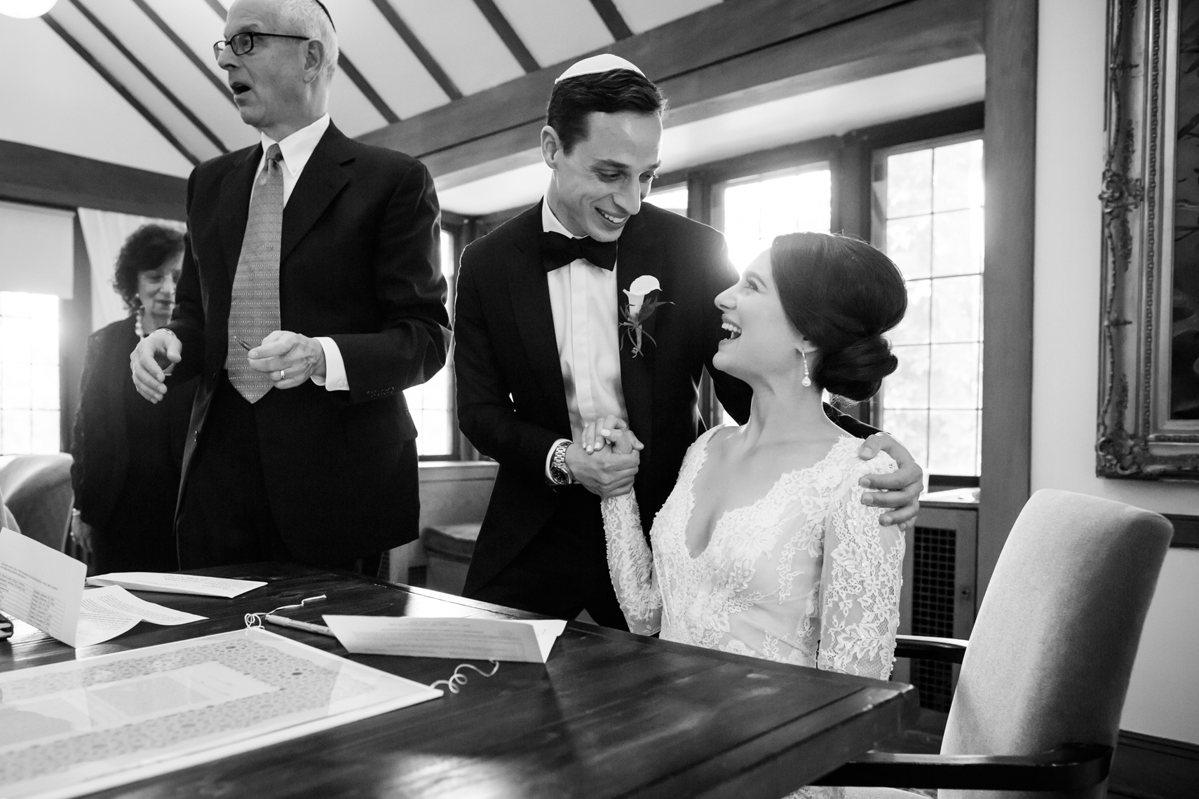 bride and groom signing ketubah at Lyndhurst Mansion